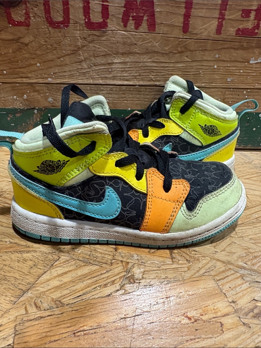 Jordan 1’s Kids High-Top Sneakers in Black, Blue, Yellow & Orange